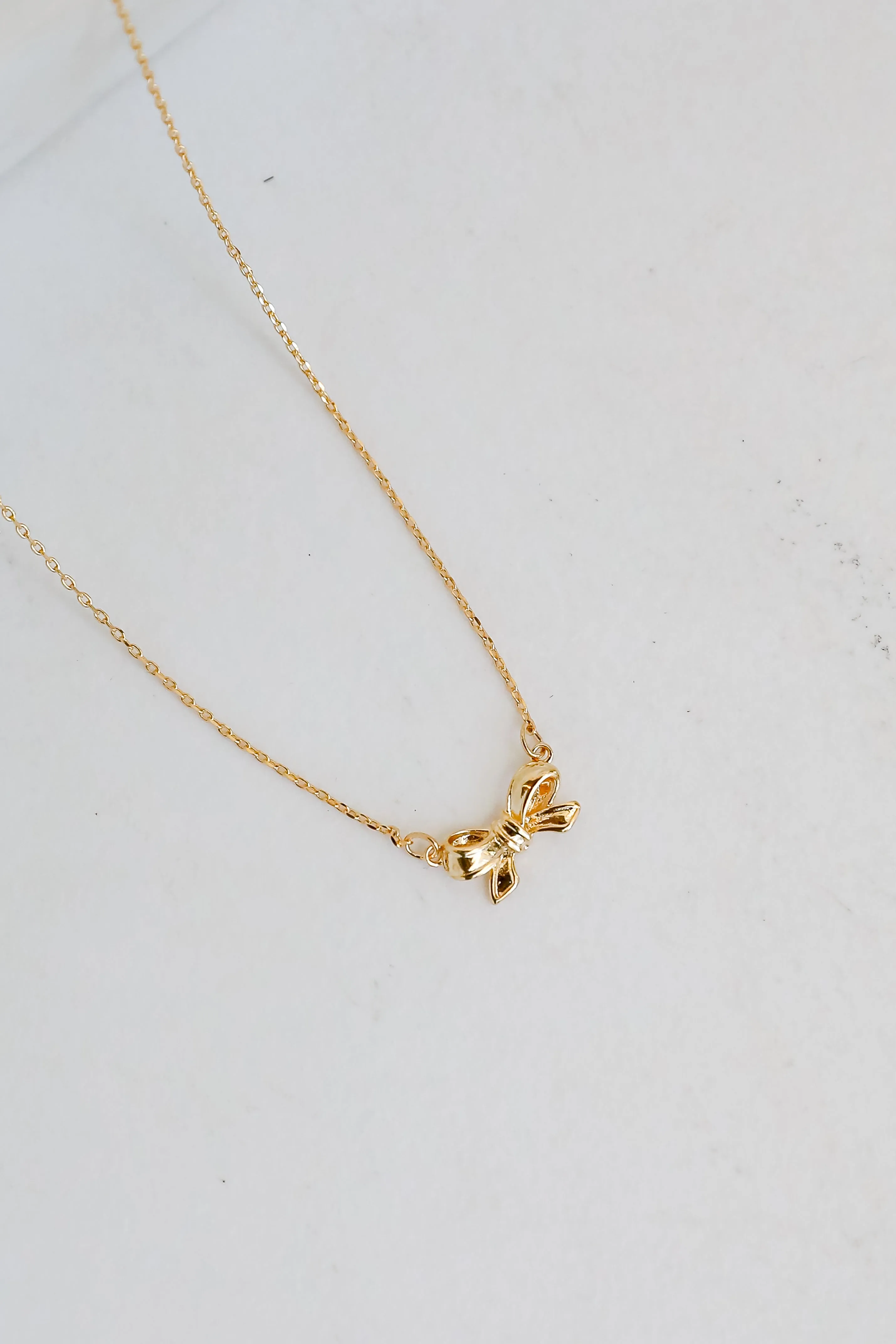 Brooke Gold Bow Charm Necklace